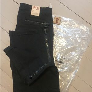 Black jeans with black zippers